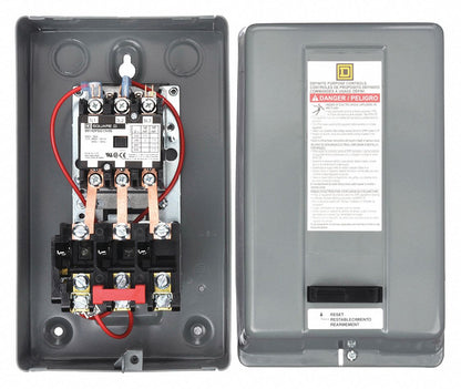 Electrical control panel with wiring and warning label on a white background